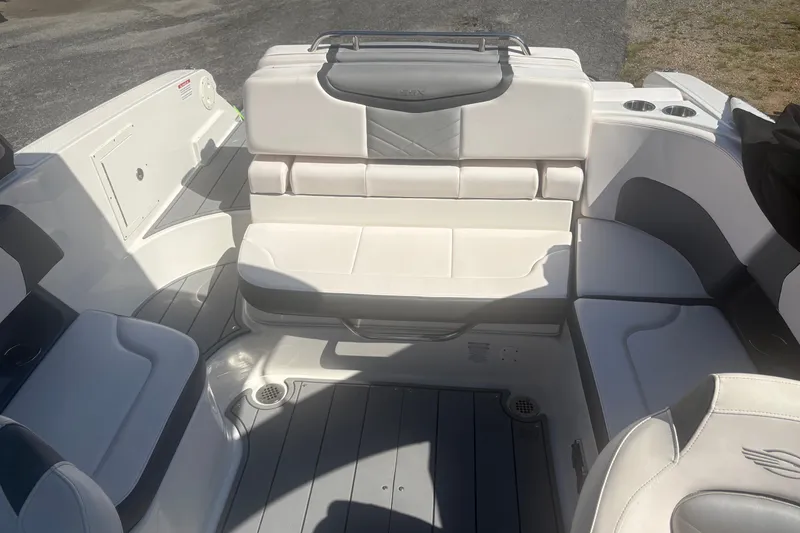 Slide: The Image of 2021 Chaparral 267 SSX boat interior with white seating and modern design. - 8