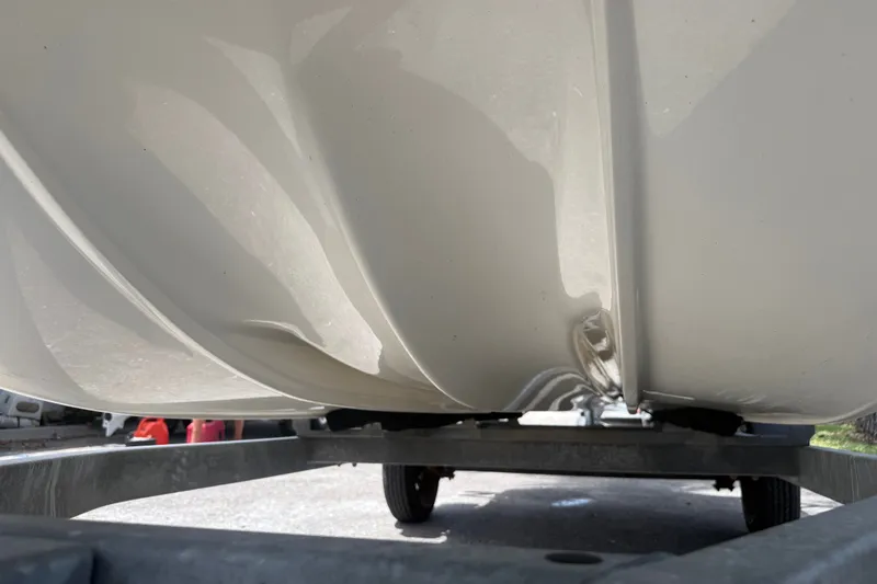 Slide: The Image of 2016 Mako Pro Skiff 16 CC hull on trailer, showcasing underside design. - 27