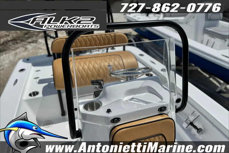 Slide: The Image of 2027 ALK2 Powerboats 17HS console with tan seating and steering wheel. - 14