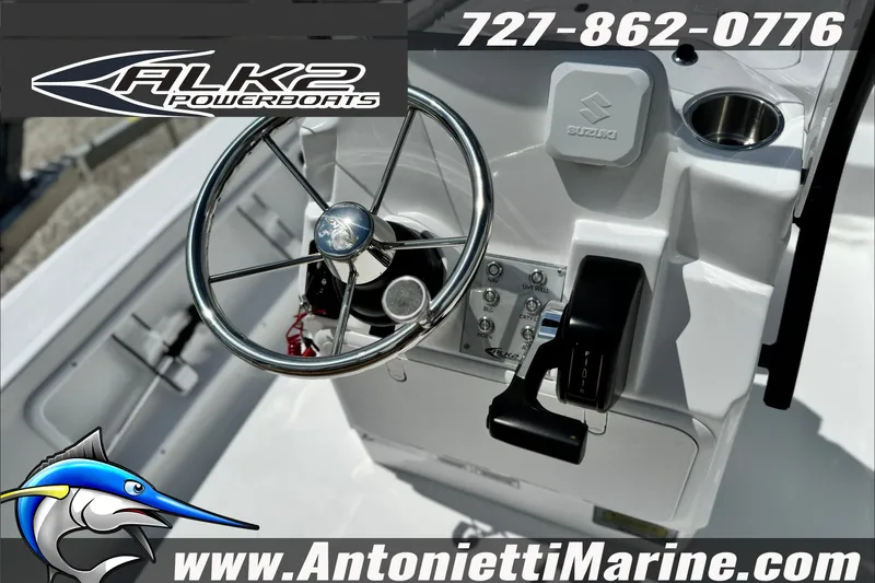 Slide: The Image of Steering console of 2027 ALK2 Powerboats 17HS with controls and branding. - 10