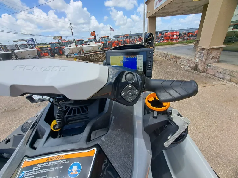Slide: The Image of The image shows the cockpit of a 2022 Sea-Doo FISH PRO TROPHY 170 with a display and controls. - 18