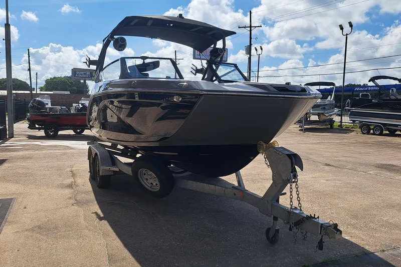 Slide: The Image of A 2025 Yamaha 222XD boat on a trailer in an outdoor setting. - 7