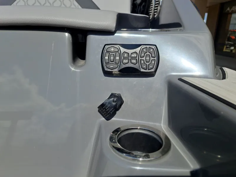 Slide: The Image of Close-up of a control panel on a 2025 Yamaha 222XD boat. - 35