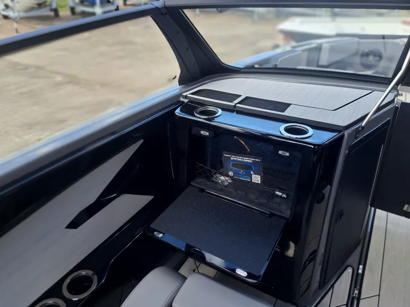 Slide: The Image of The image shows the cockpit of a 2025 Yamaha Boats 222XD with modern controls. - 22