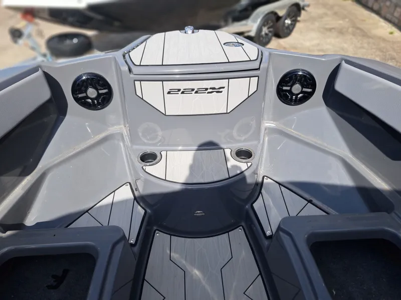 Slide: The Image of The image shows the bow area of a Yamaha 222XD boat with gray interior and speakers. - 16