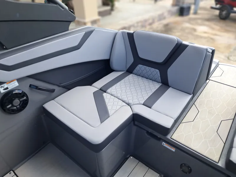 Slide: The Image of The 2025 Yamaha 222XD features modern gray upholstery with geometric patterns in the seating area. - 26
