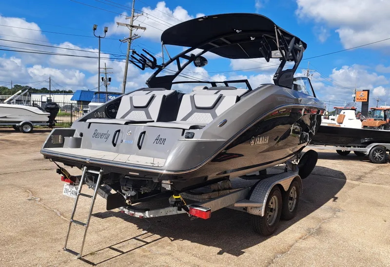 Slide: The Image of A 2025 Yamaha 222XD boat on a trailer, ready for transport. - 9