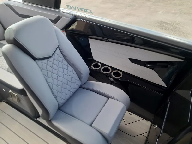 Slide: The Image of The interior of a 2025 Yamaha Boats 222XD with sleek gray seating and modern detailing. - 24