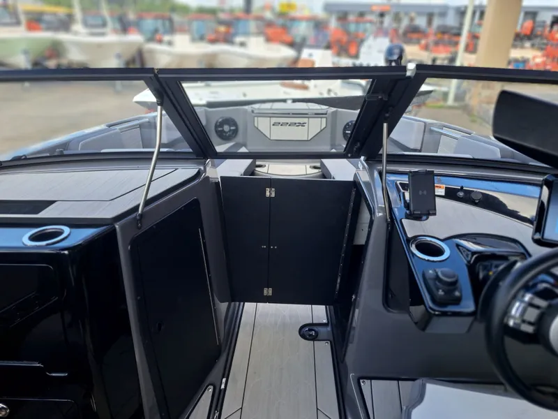 Slide: The Image of The image shows the cockpit of a Yamaha 222XD boat with modern controls and a sleek design. - 21