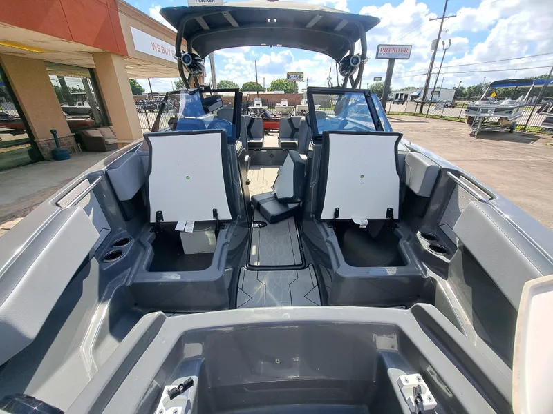 Slide: The Image of The image shows the interior of a 2025 Yamaha 222XD boat with modern seating and controls. - 14