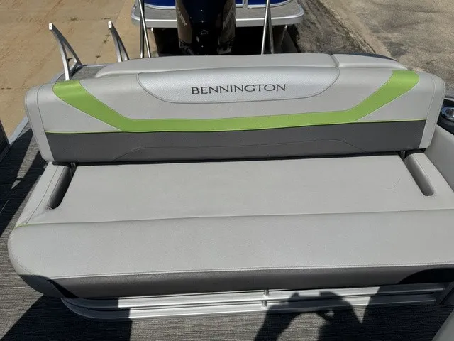 Slide: The Image of The rear bench of a 2022 Bennington 22 SSBX with gray and green upholstery. - 15