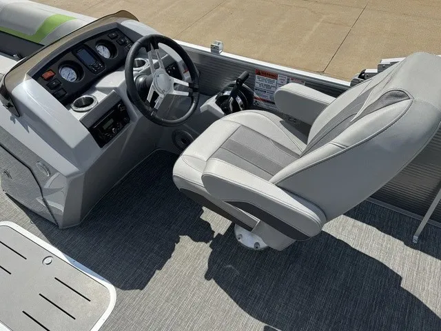 Slide: The Image of The image shows the helm of a 2022 Bennington 22 SSBX with a gray seat and dashboard. - 11