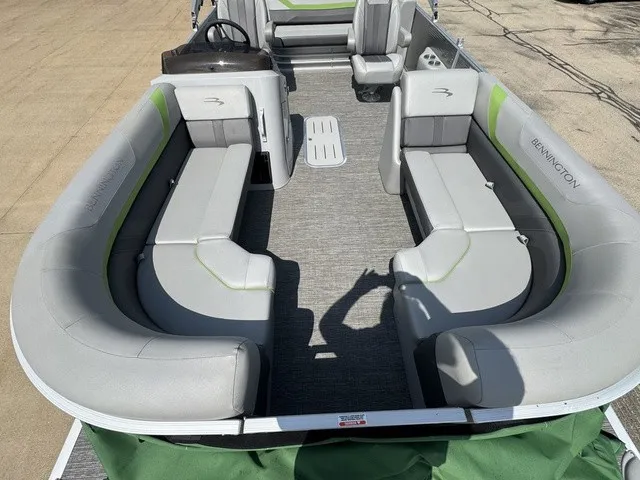 Slide: The Image of The image shows the interior of a 2022 Bennington 22 SSBX pontoon boat with gray seating. - 8
