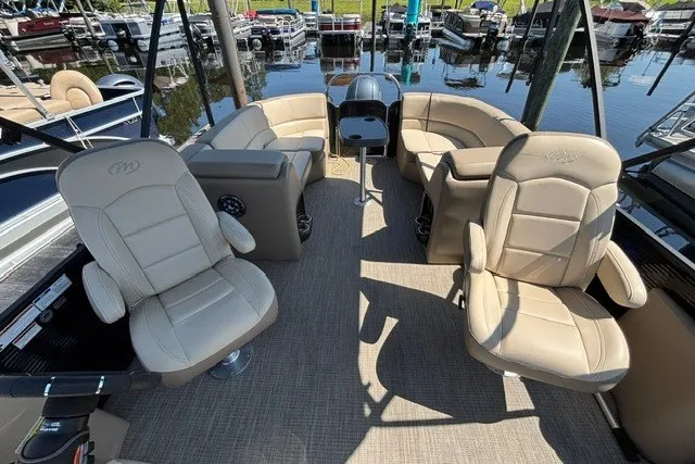 Slide: The Image of Interior of 2022 Manitou 23 Aurora pontoon boat with beige seating and modern design. - 19