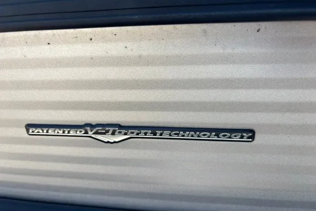 Slide: The Image of Patented V-Toon technology badge on 2022 Manitou 23 Aurora boat. - 28