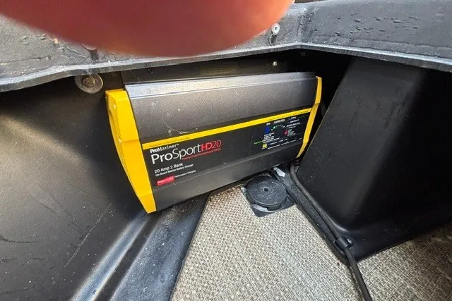 Slide: The Image of ProMariner ProSport HD20 charger in 2022 Manitou 23 Aurora boat compartment. - 25