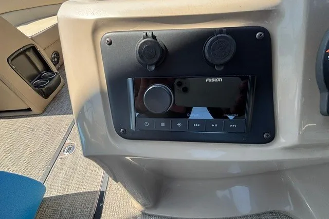 Slide: The Image of Control panel of 2022 Manitou 23 Aurora boat with Fusion audio system. - 24
