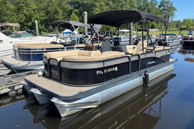 The Image of 2022 Manitou 23 Aurora pontoon boat docked on a sunny day. - 1