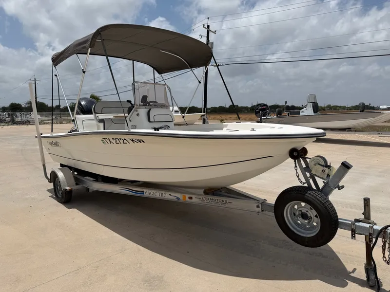 Slide: The Image of A 2016 Cape Craft 180cc boat on a trailer, featuring a Bimini top and steering console. - 6