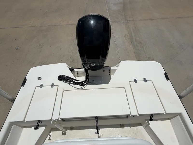 Slide: The Image of The image shows the stern of a Cape Craft 180cc boat with an outboard motor. - 23