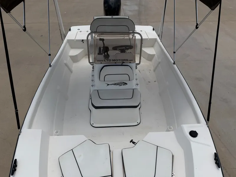 Slide: The Image of A 2016 Cape Craft 180cc boat with an open deck, steering console, and seating. - 17
