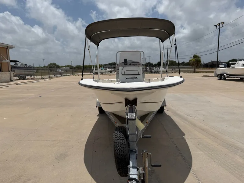 Slide: The Image of A 2016 Cape Craft 180cc boat on a trailer under a cloudy sky. - 5