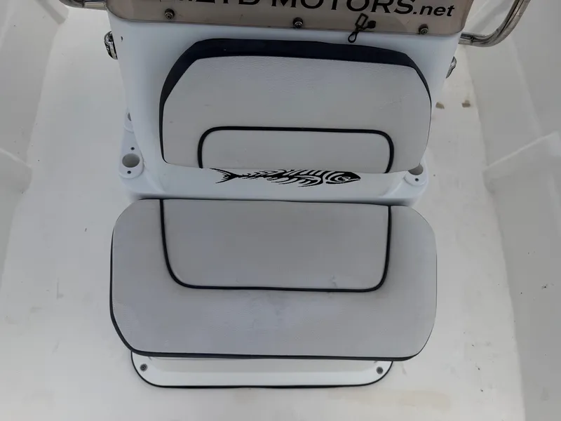 Slide: The Image of The seating area of a Cape Craft 180cc boat with a fish design on the backrest. - 18