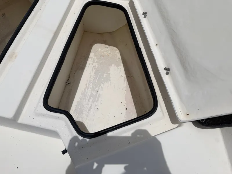 Slide: The Image of An open storage compartment on a 2016 Cape Craft 180cc boat. - 15