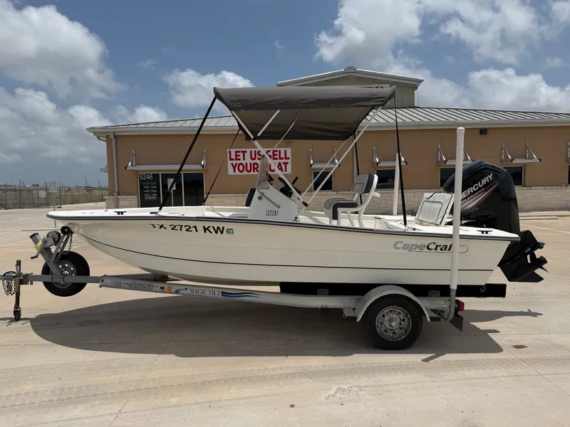 The Image of A 2016 Cape Craft 180cc boat on a trailer in front of a building. - 1