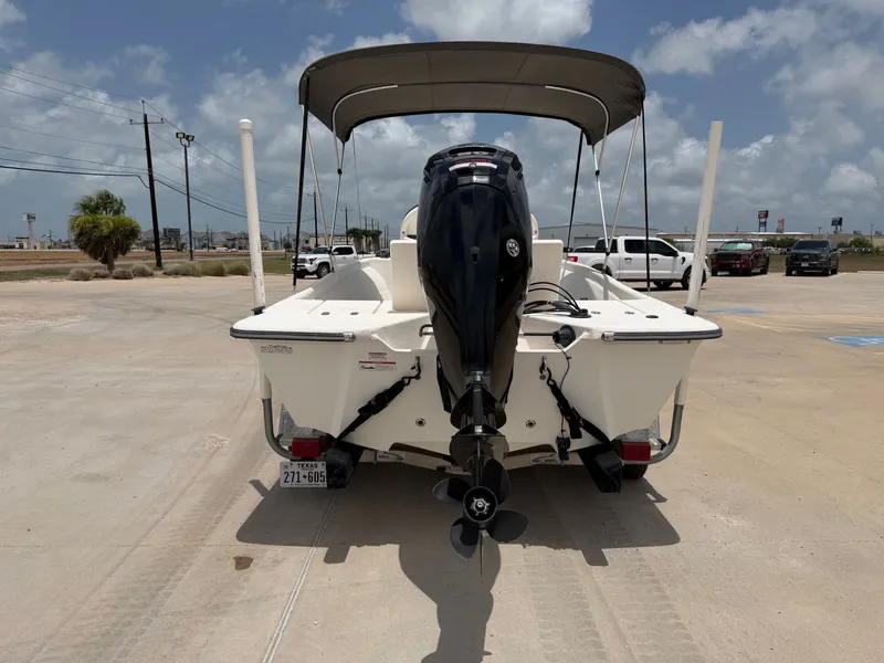 Slide: The Image of A 2016 Cape Craft 180cc boat with an outboard motor, parked on a trailer. - 9