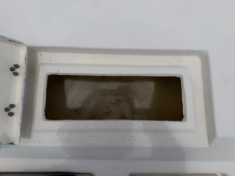 Slide: The Image of A rectangular compartment on a boat, possibly a storage area or livewell. - 16