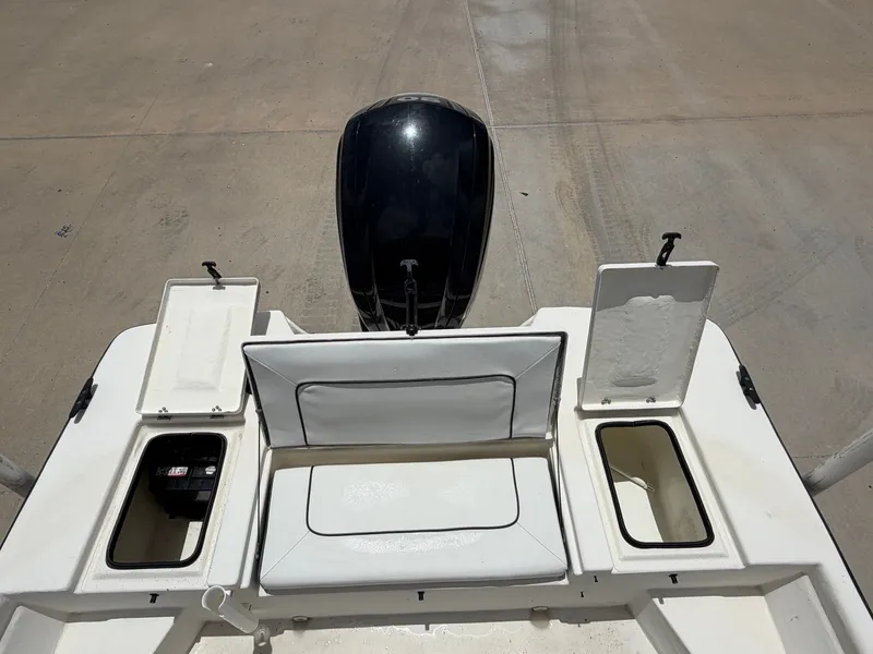 Slide: The Image of The image shows the stern of a Cape Craft 180cc boat with open storage compartments. - 24