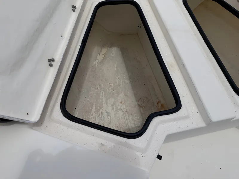 Slide: The Image of An open storage compartment on a 2016 Cape Craft 180cc boat. - 14