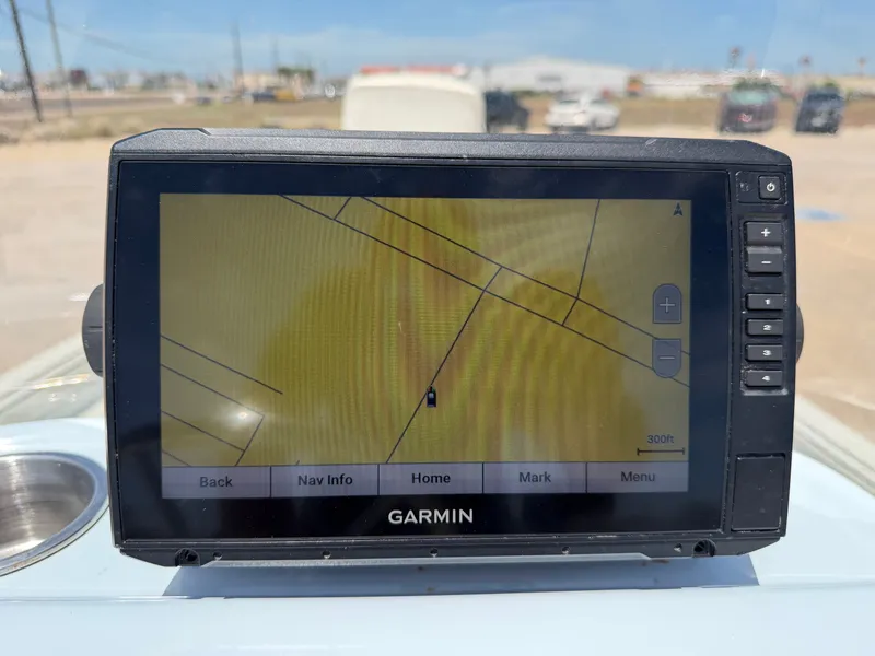 Slide: The Image of A Garmin navigation device on a boat displays a map with course lines. - 23
