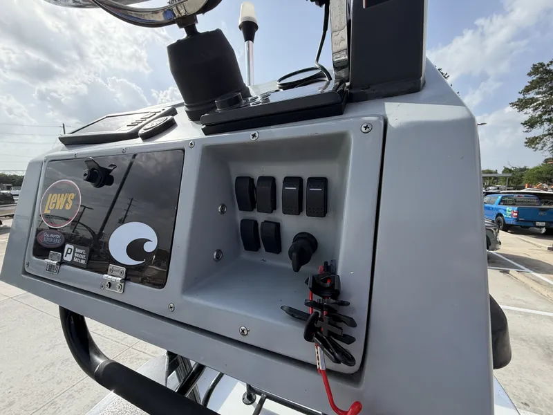 Slide: The Image of The image shows the console of an Exuma 17 Island Skiff with various switches and instruments. - 19