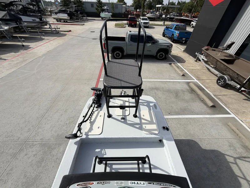 Slide: The Image of A 2016 Exuma 17 Island Skiff is parked in a lot. It features a raised platform. - 18