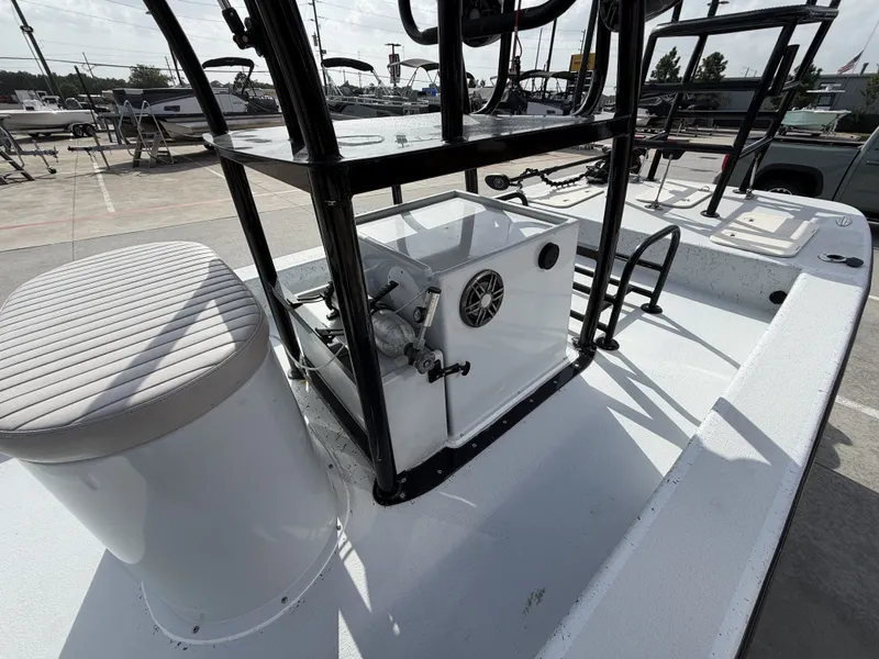 Slide: The Image of The image shows a 2016 Exuma 17 Island Skiff with a white deck and black frame. - 15