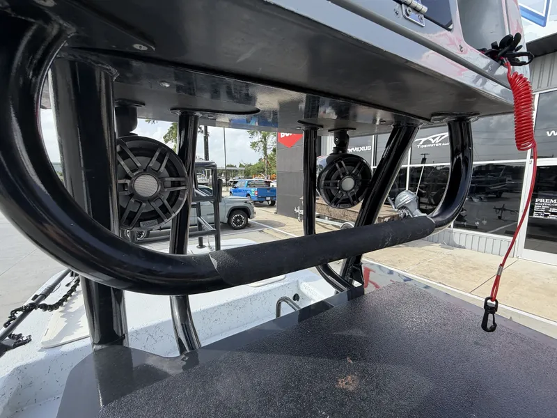 Slide: The Image of The image shows the cockpit of a 2016 Exuma 17 Island Skiff with speakers and grab rails. - 22