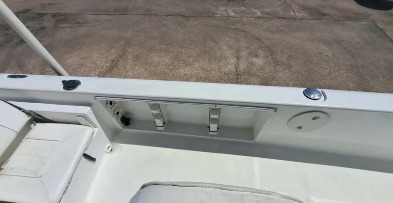 Slide: The Image of The image shows the deck of a 2011 Sea Hunt XP21 boat with white seating. - 20