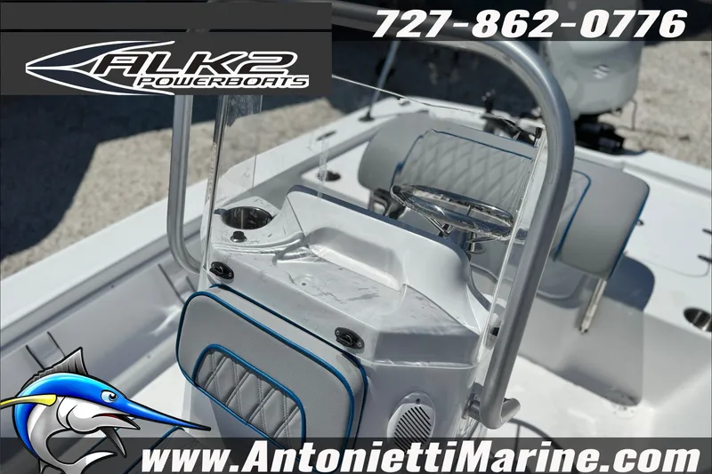 Slide: The Image of 2027 ALK2 Powerboats 17HS interior with steering console and seating. - 10