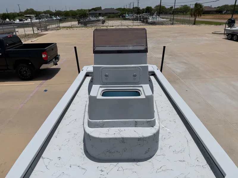 Slide: The Image of The image shows the deck of a 2027 Shoalwater 23 CAT RSD boat parked in a lot. - 14