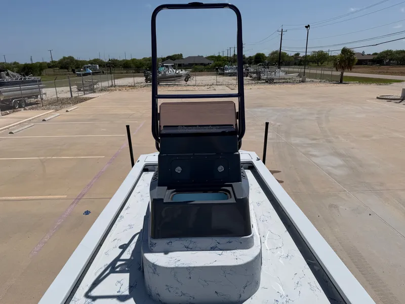 Slide: The Image of The image shows the deck of a 2027 Shoalwater 23 CAT RSD boat with a raised helm. - 17