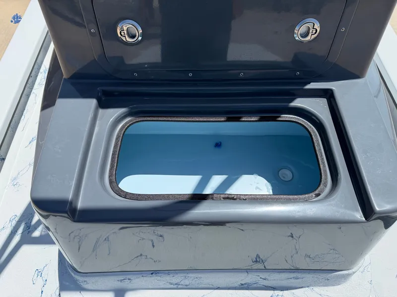 Slide: The Image of A gray boat compartment with an open hatch and two round handles. - 18
