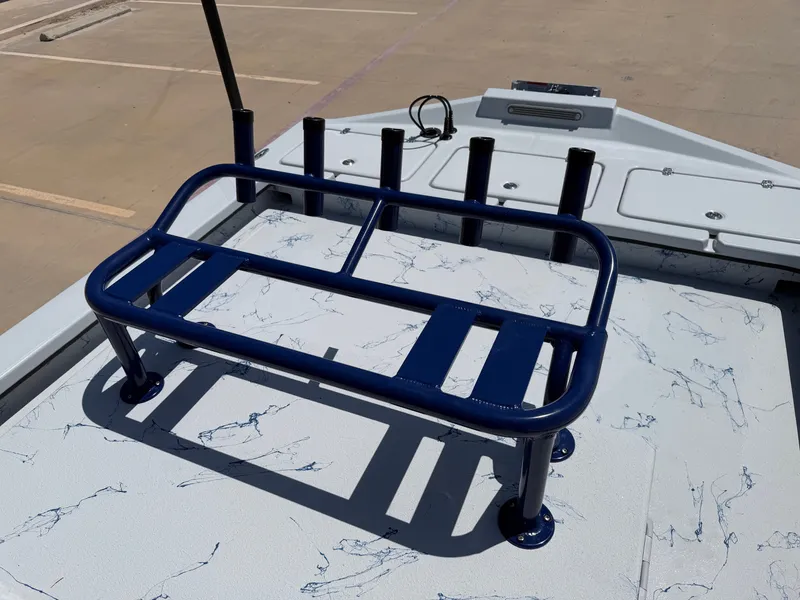 Slide: The Image of The image shows the deck of a 2027 Shoalwater 23 CAT RSD with blue railings. - 20
