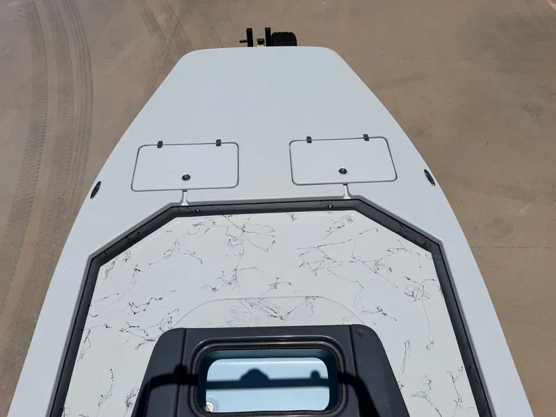 Slide: The Image of The image shows the deck of a Shoalwater 23' Catamaran with two hatches and a window. - 15