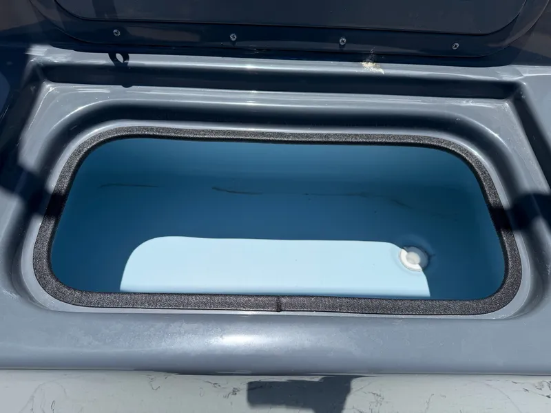 Slide: The Image of A gray boat tank with an oval lid and blue interior. - 17