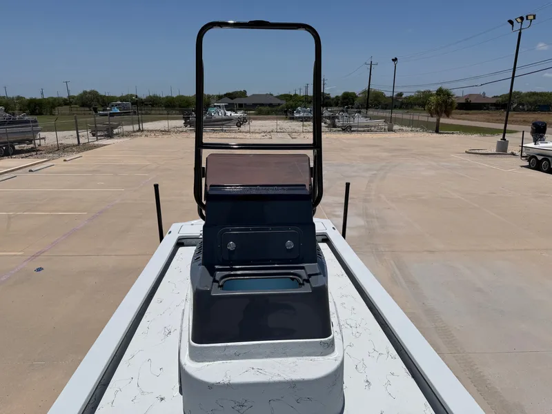 Slide: The Image of The image shows the deck of a 2027 Shoalwater 23' Catamaran parked in a lot. - 16