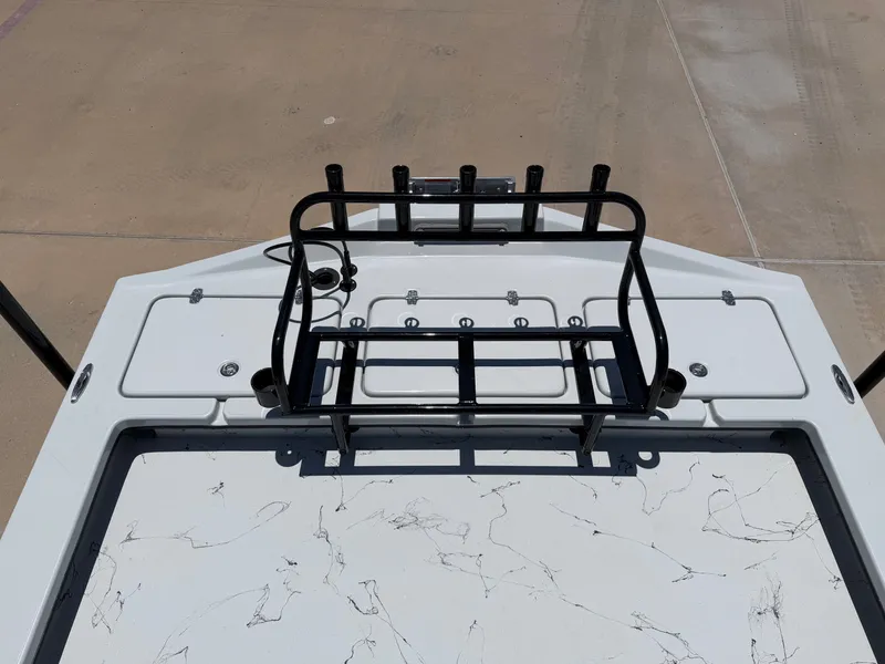 Slide: The Image of The image shows the deck of a Shoalwater 23' Catamaran with fishing rod holders. - 20