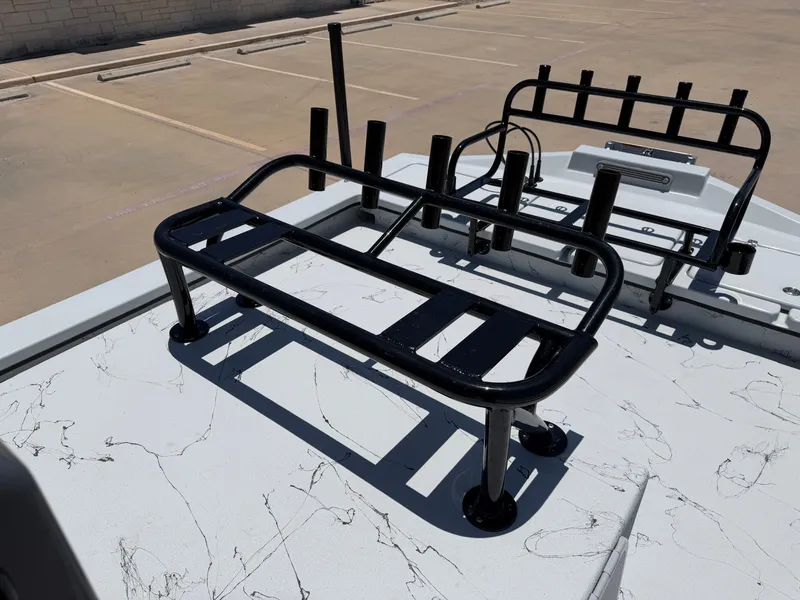 Slide: The Image of The image shows the deck of a Shoalwater 23' Catamaran with black metal railings. - 19