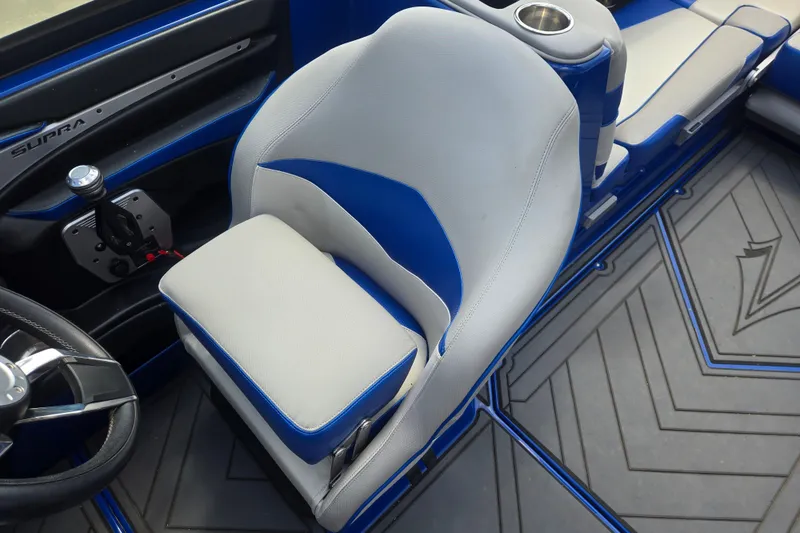 Slide: The Image of 2017 Supra SG 400-550 boat interior with blue and white seating and steering wheel. - 14
